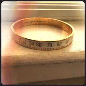 Kate Spade “Tune In” white & gold bracelet